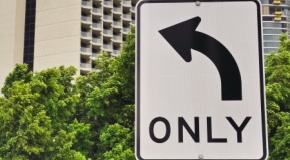 Street sign with left-turn arrow and the word “only” underneath. 